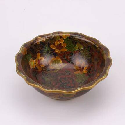 Vintage Asian brass bowl with floral decoration.
