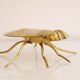 Empty vintage pocket in the shape of a brass insect