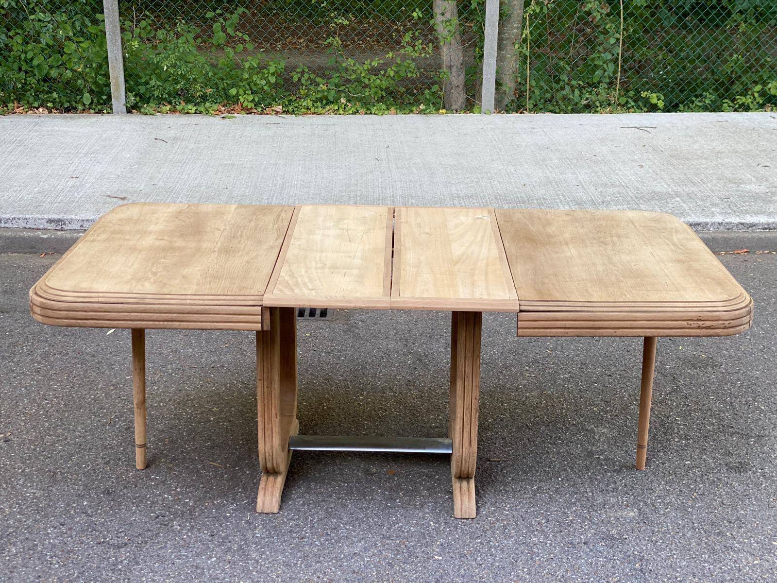 Art Deco dining table with a central pedestal, stripped in solid oak, with 2 extensions.
