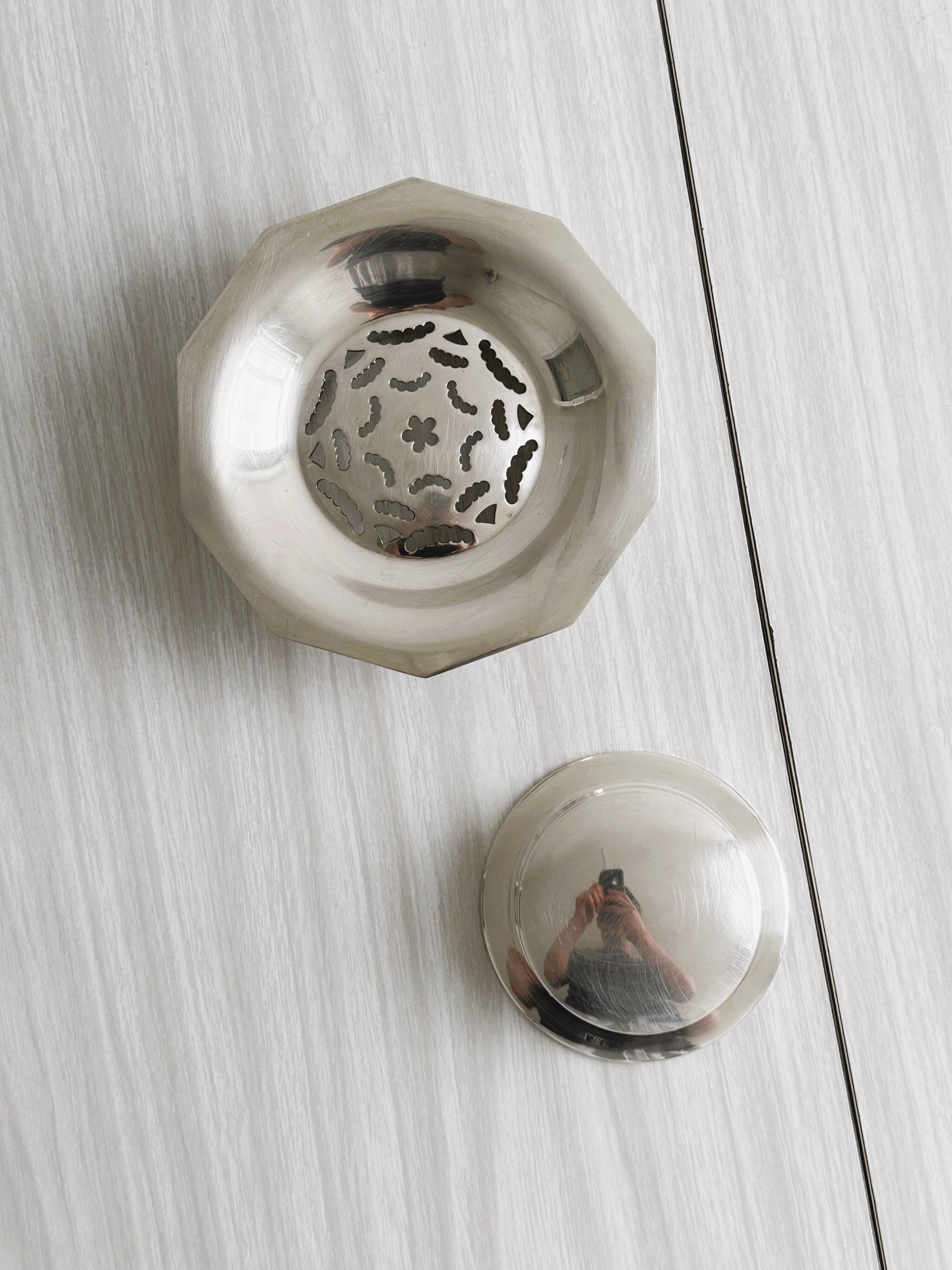 Antique butter dish in shiny metal