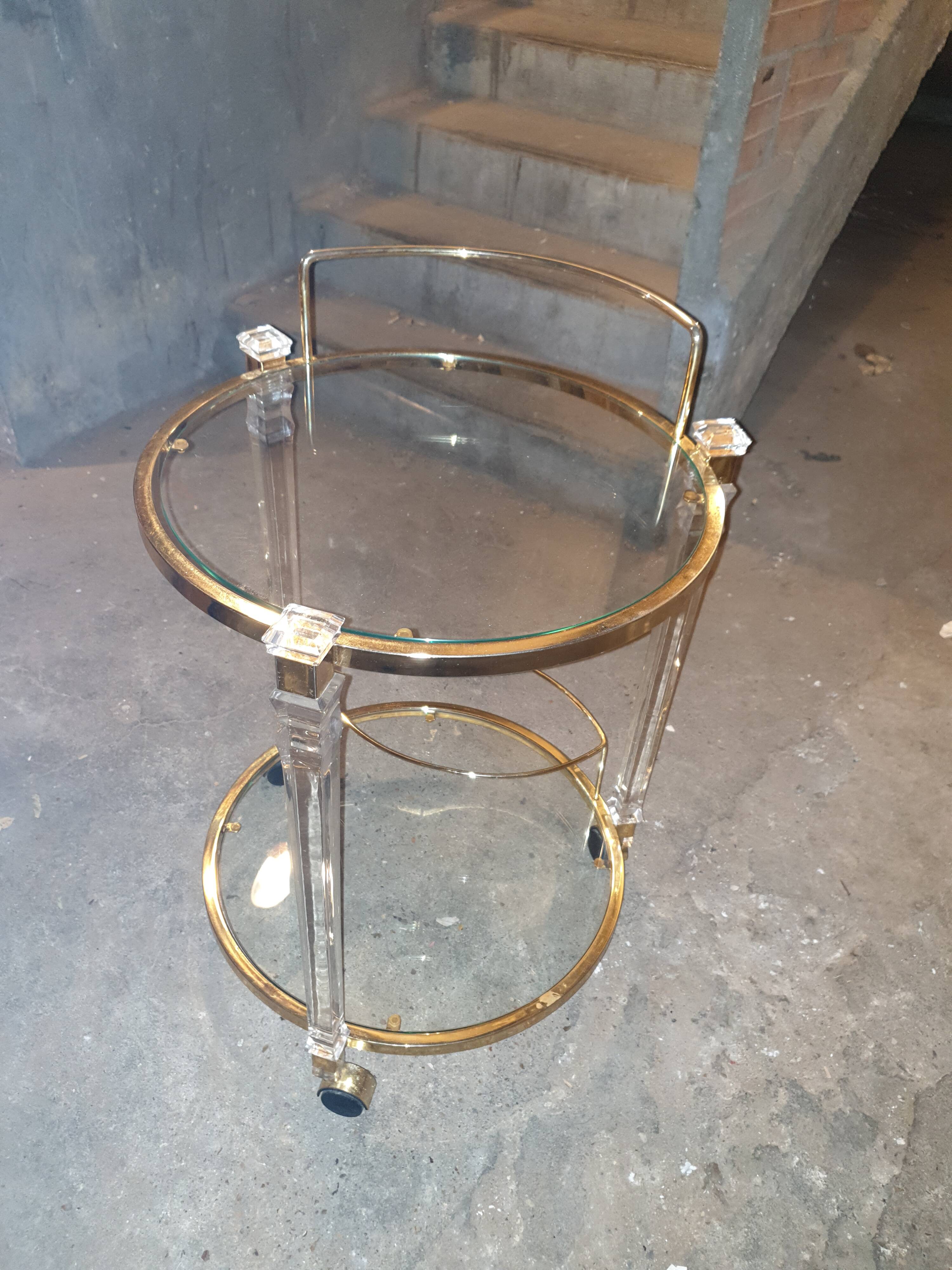 Round table in glass and brass and acrylic columns, 1980
