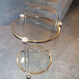 Round table in glass and brass and acrylic columns, 1980
