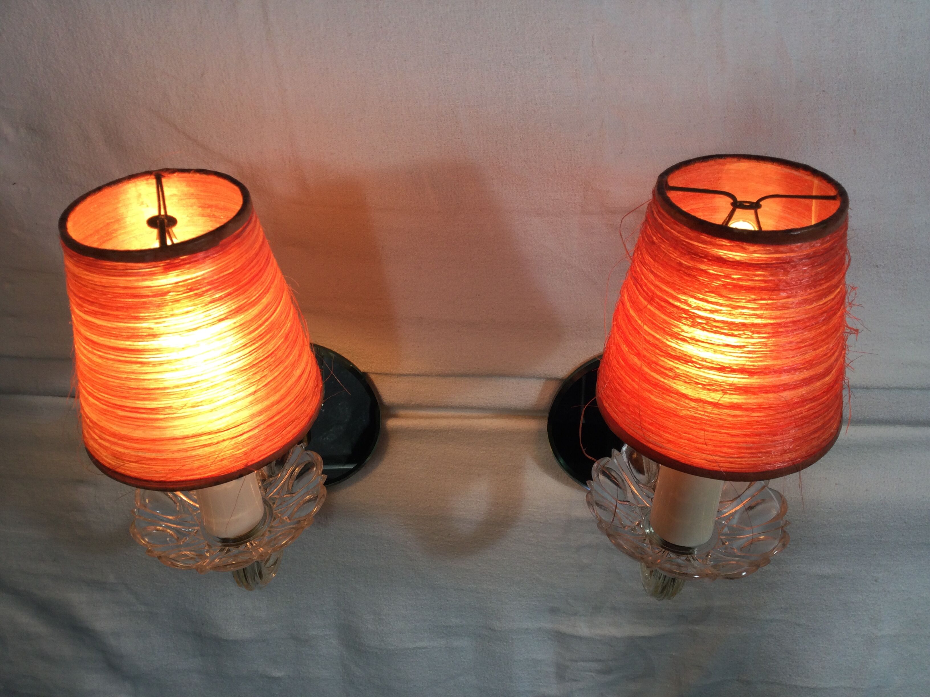 Pair of glass and mirror sconces