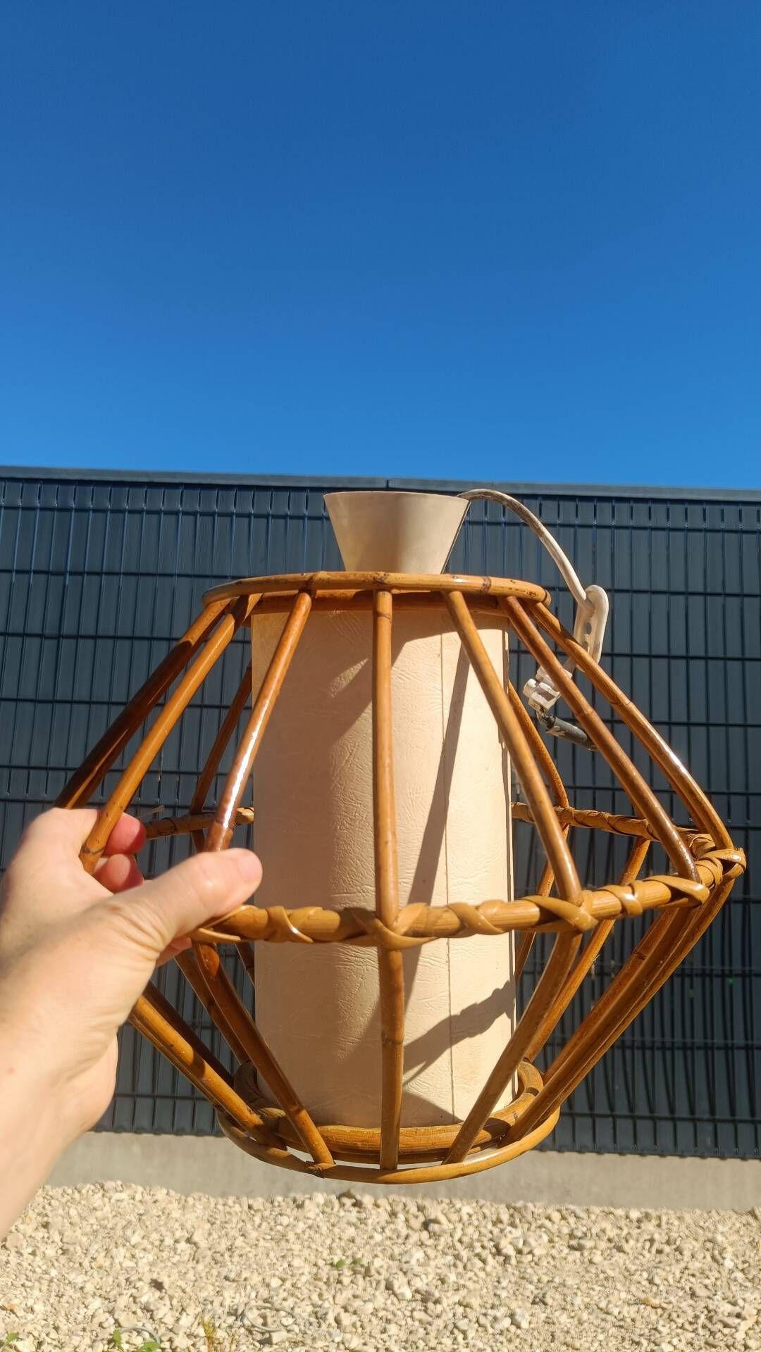 Vintage rattan and bamboo pendant light with removable shade.
