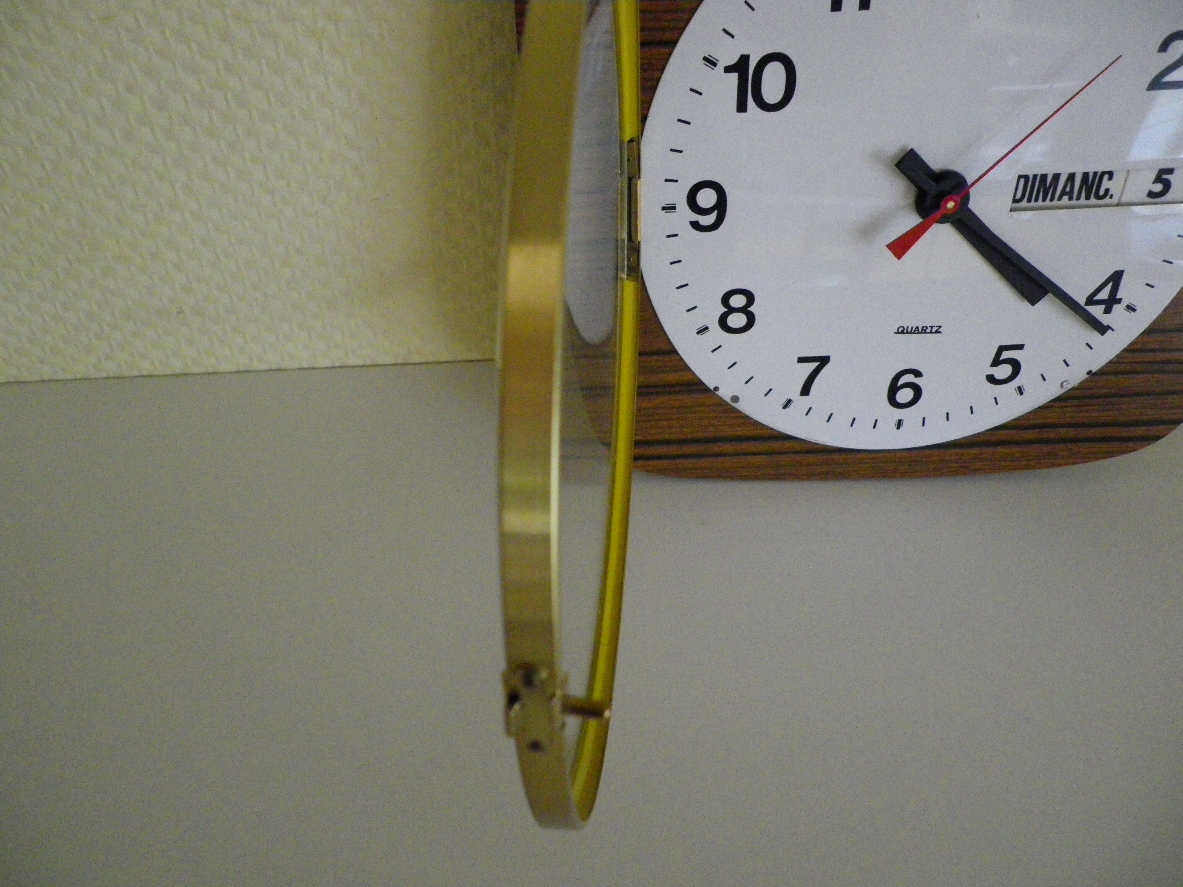 Formica wall clock with day and date - 1970s
