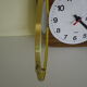Formica wall clock with day and date - 1970s