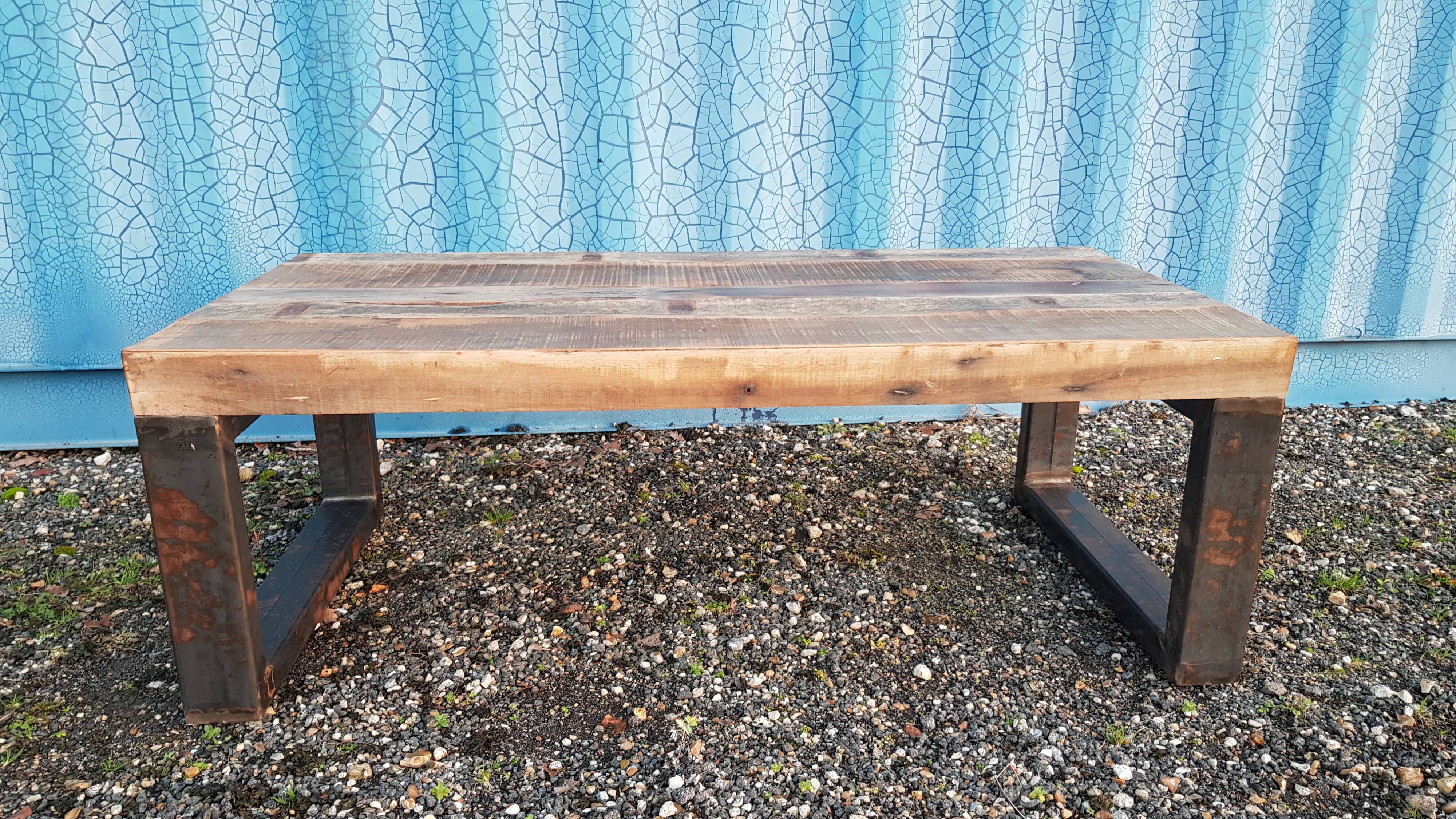 Industrial coffee table with wooden top and metal legs