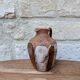 Old small pitcher in glazed terracotta