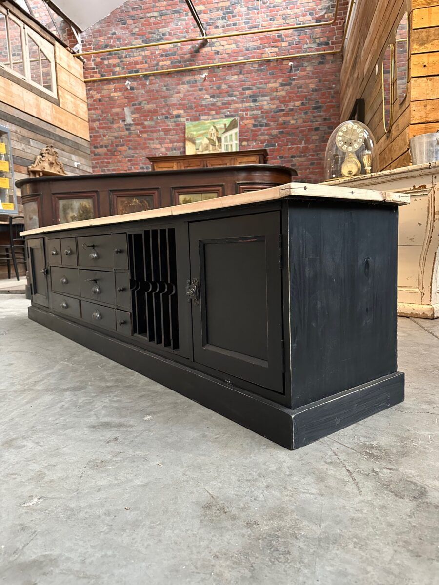 Old workshop furniture transformed into a TV unit.