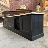 Old workshop furniture transformed into a TV unit.