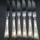 12 silver metal table knives model Rocaille