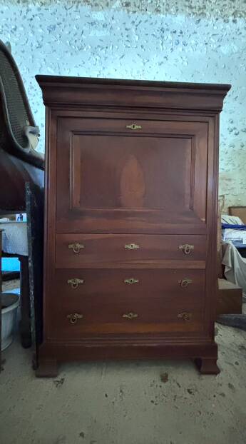 Secretary desk with mahogany and flame veneer.