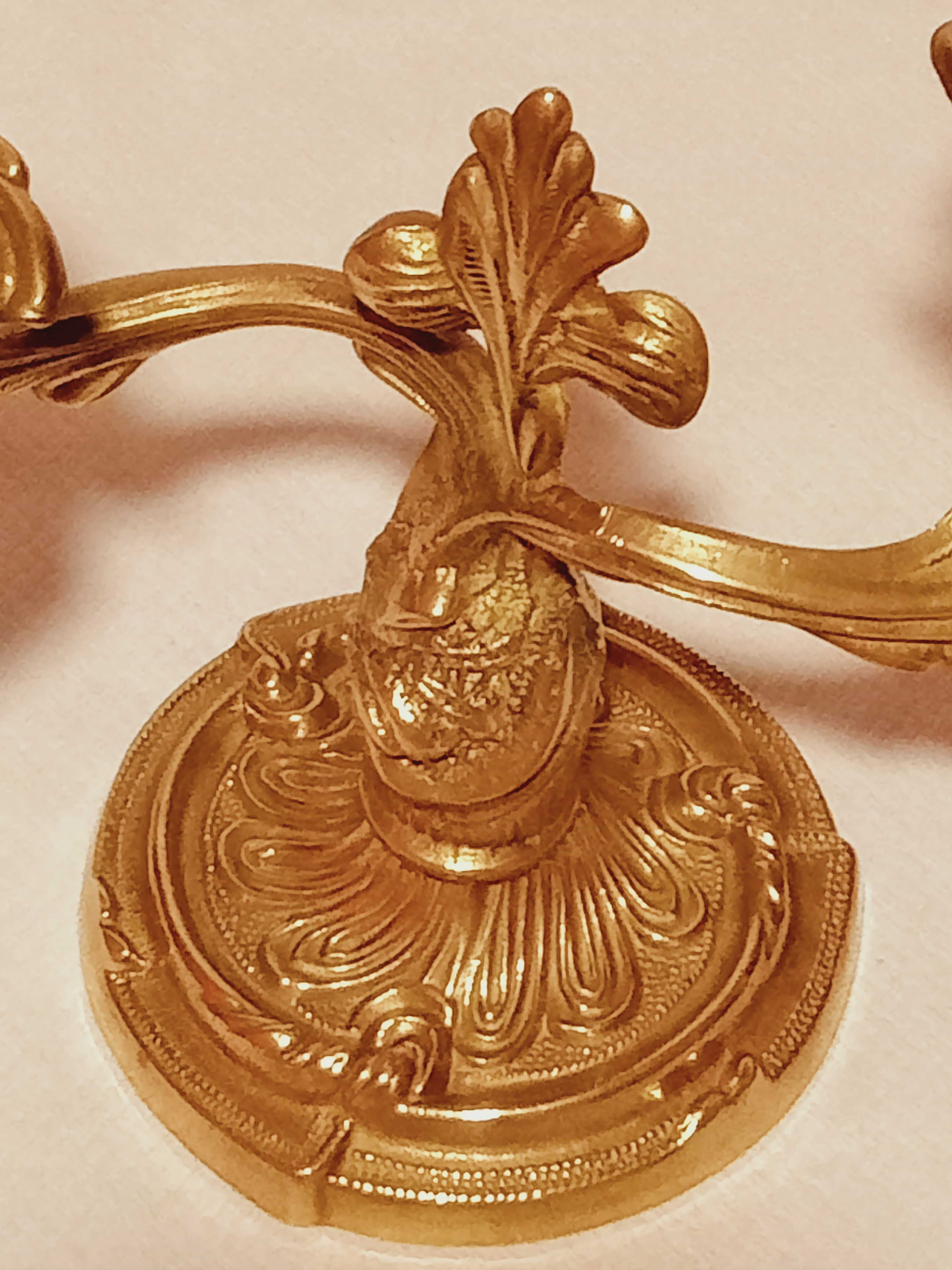 Old candle holder in gilded bronze