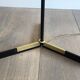 Designer floor lamp in black lacquered metal and brass