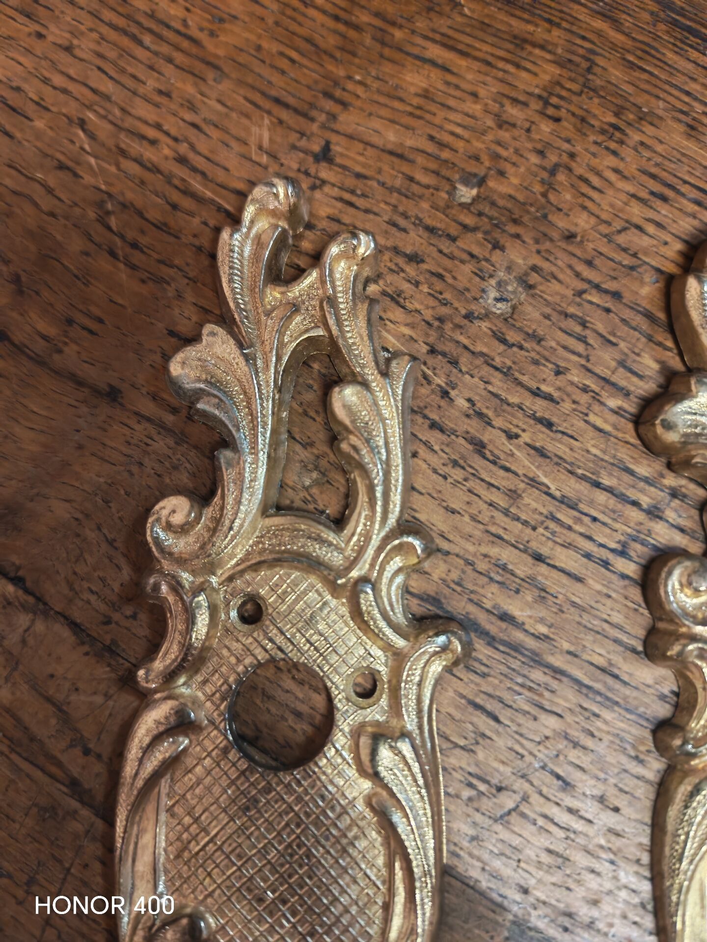 Pair of solid brass cleanliness plates in Louis XV rococo style.