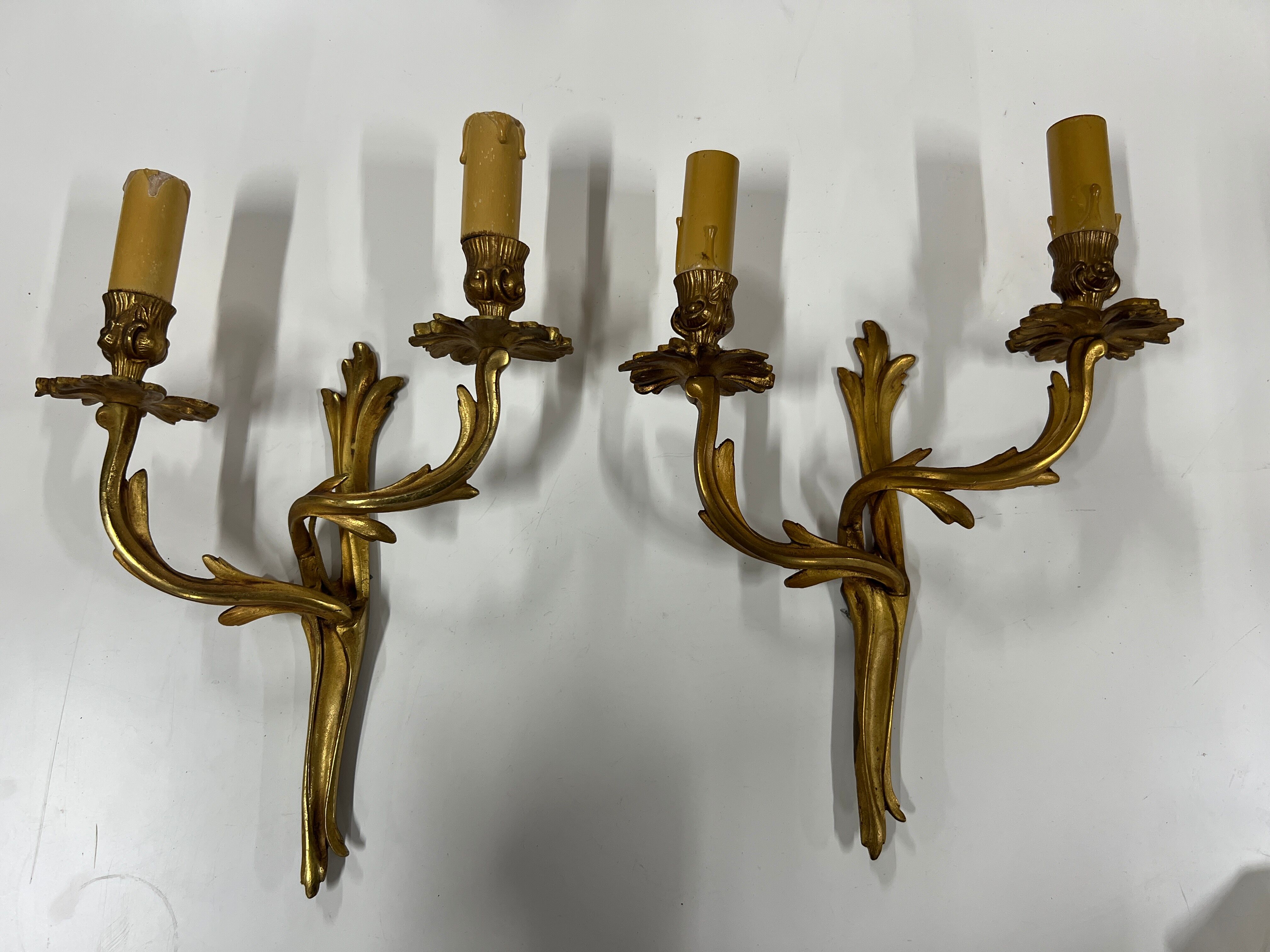 Pair of Louis XV wall lamps in gilded bronze