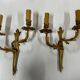Pair of Louis XV wall lamps in gilded bronze