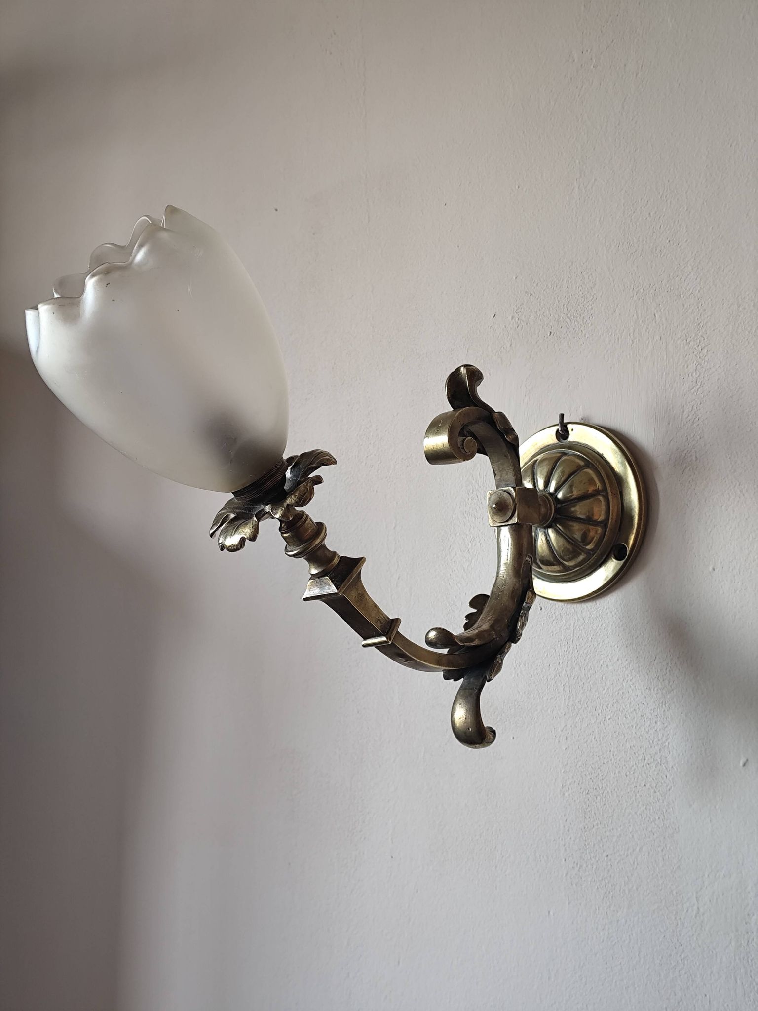Bronze wall light with opaque glass tulip 1900