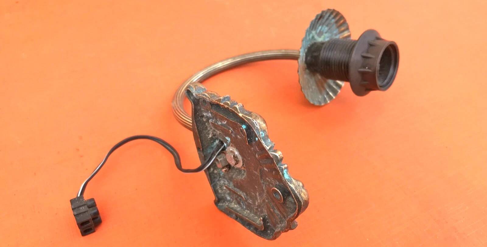Patinated brass wall light with tulip shade