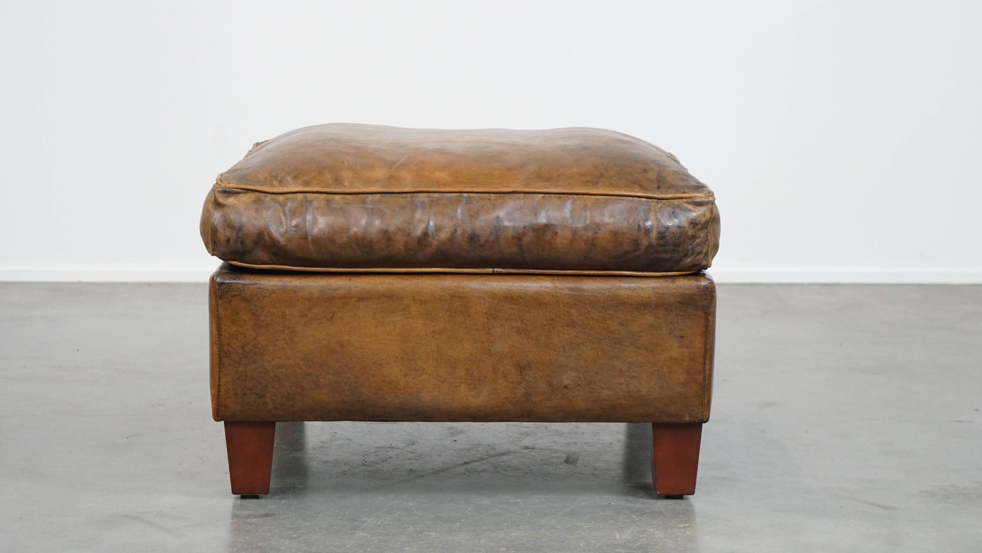 Sheepskin wing chair + XXL patinated footrest