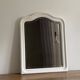 Antique mirror with a gendarme hat shape. White. 72x56.
