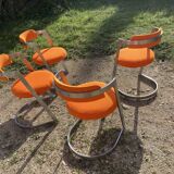 Four stainless steel armchairs from the 70s