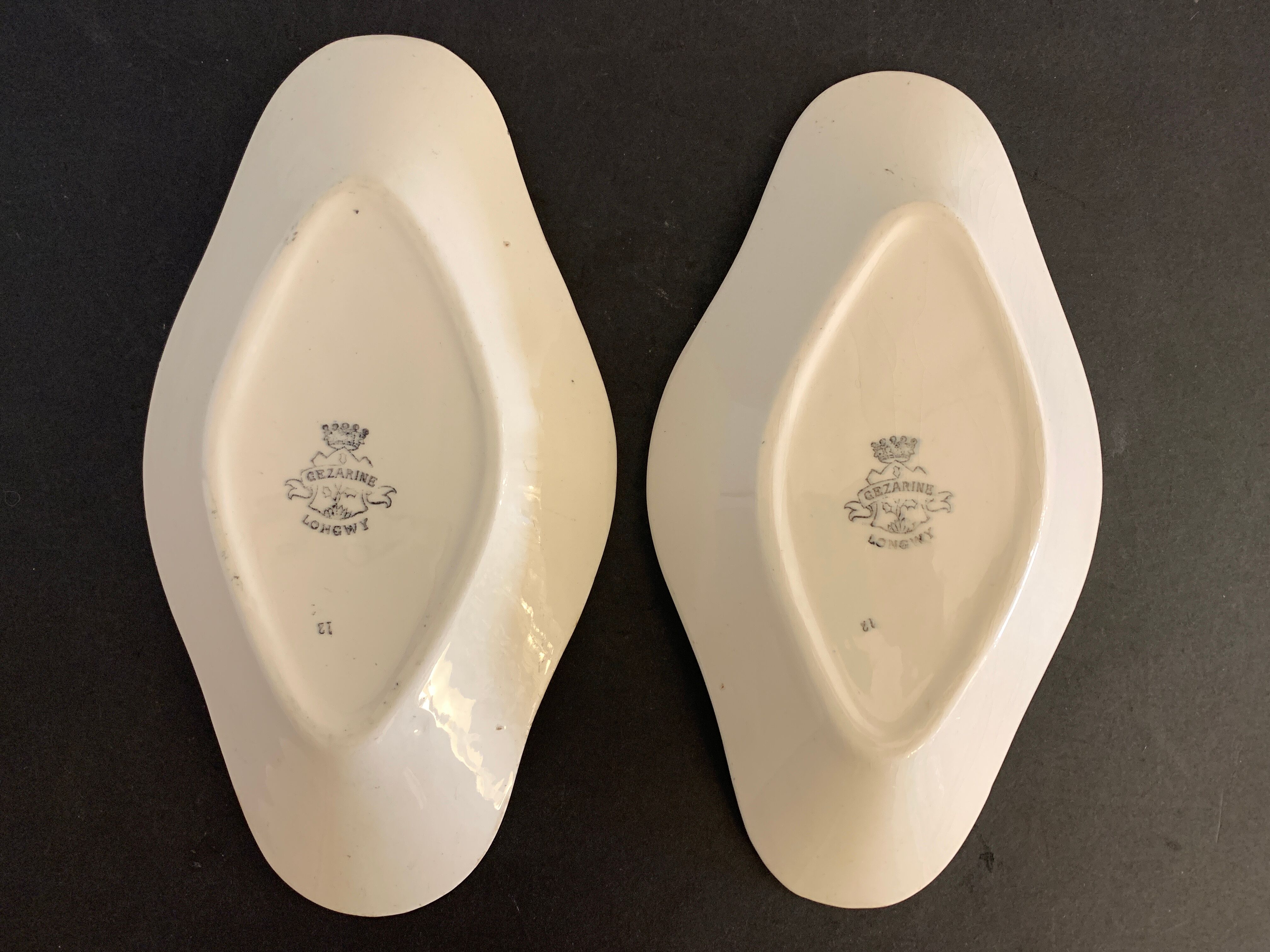 Pair of art deco raviers signed Longwy and numbered, model Gerazine