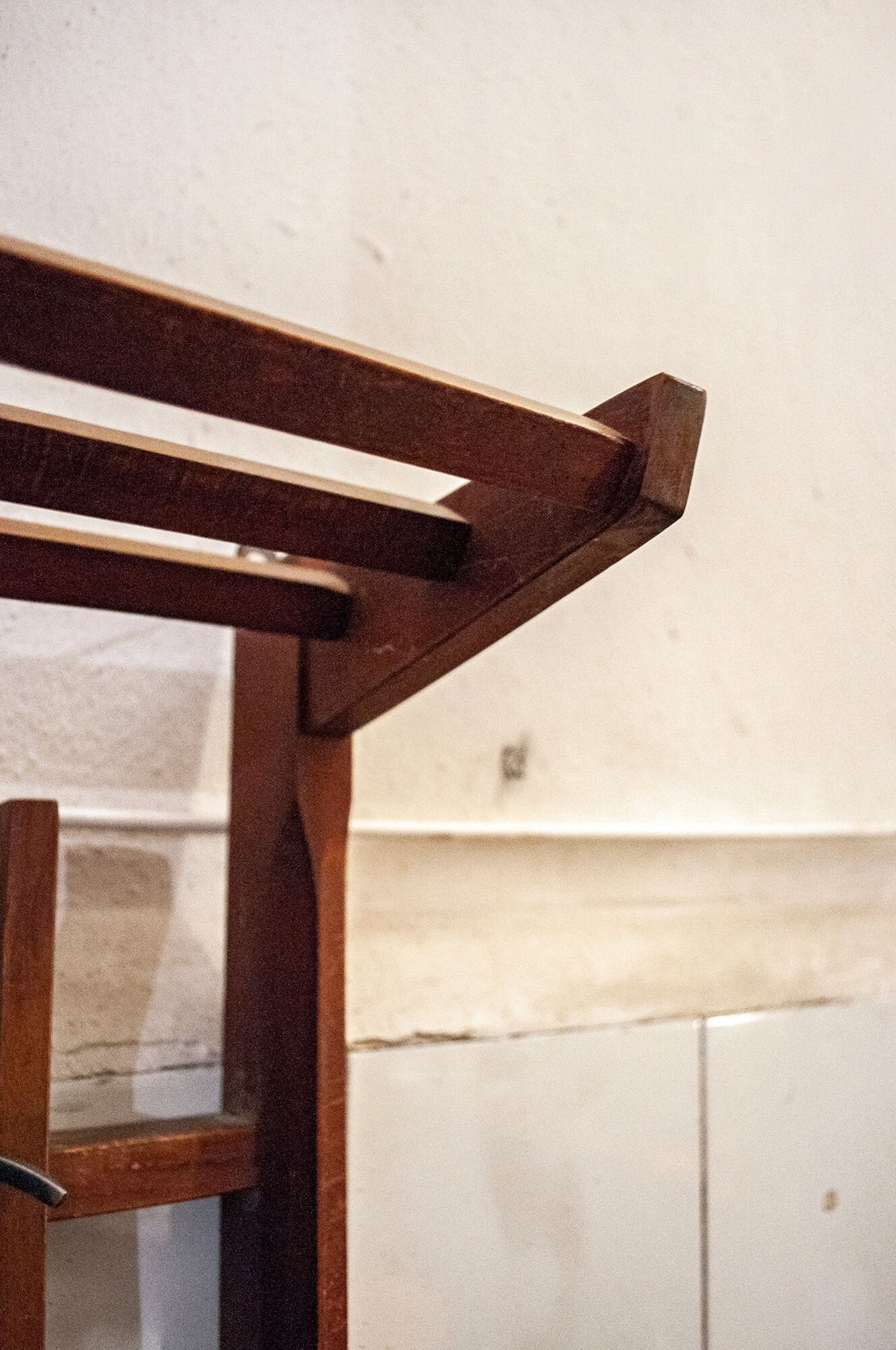 Walnut wood wall coat hangers, with metal details. Italian production 1950s