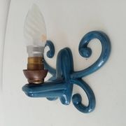 Antique wall light in enamelled cast iron.