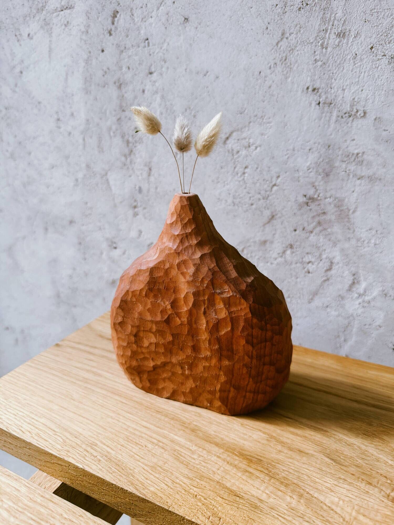 Hand-carved soliflore vase in solid cherry wood.