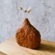 Hand-carved soliflore vase in solid cherry wood.