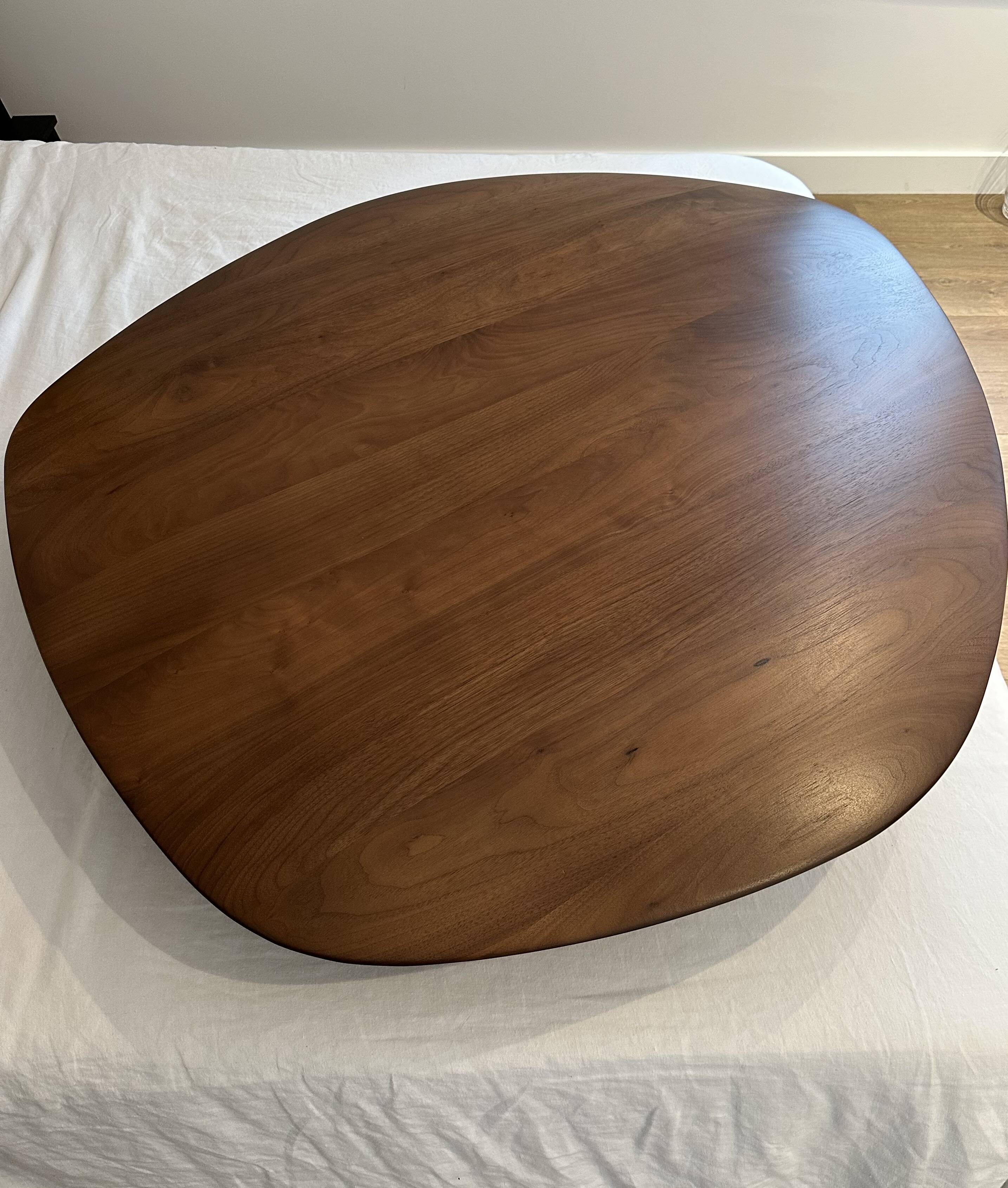 Pebble coffee table with a convex top by Cinna.