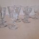 Set of 9 small cut glass stemmed glasses from the 1930s, in various sizes.