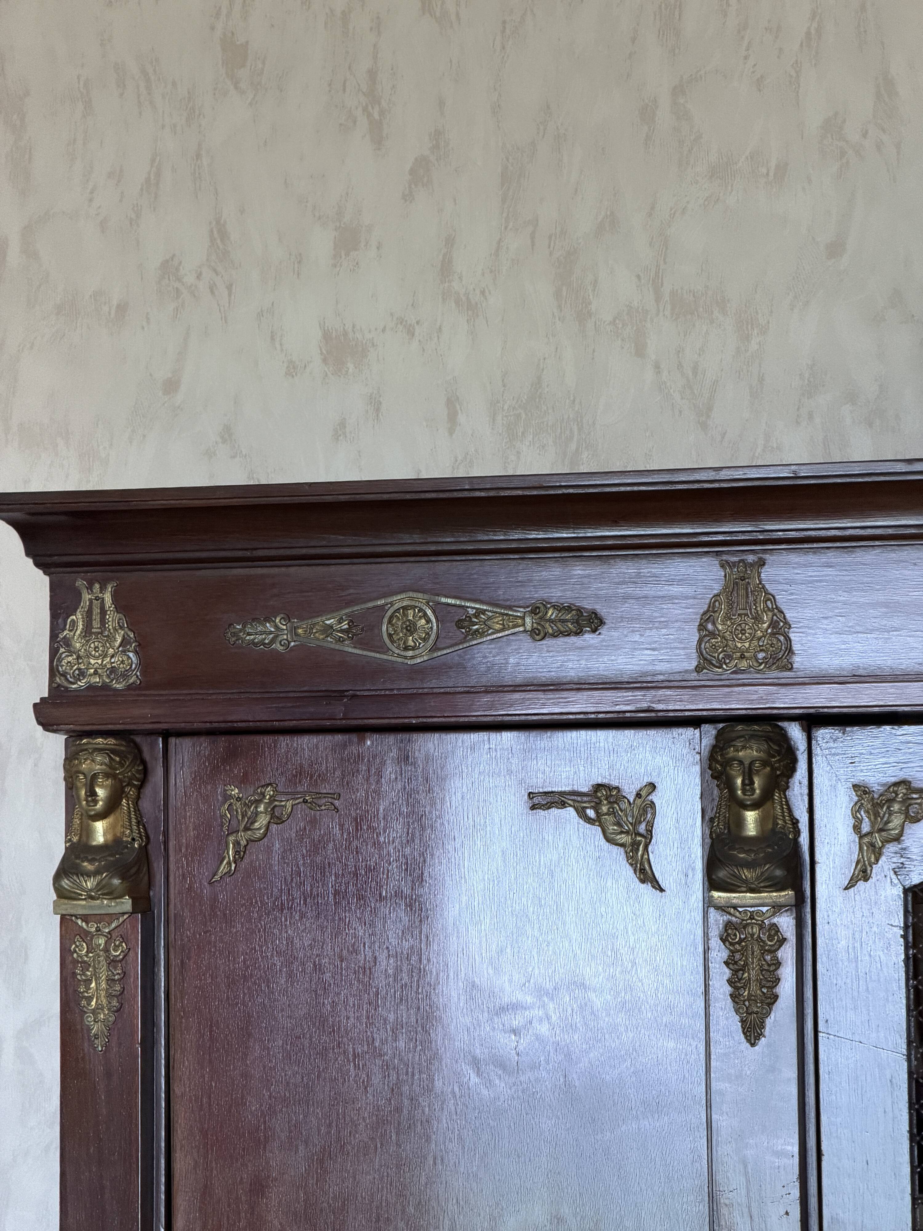 Large antique library from the Empire/Napoleon III period in mahogany and gilded bronze.