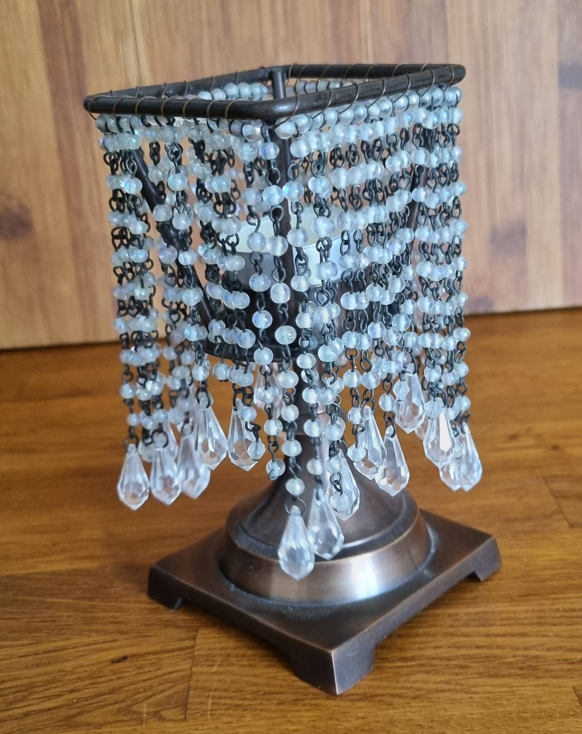 Metal candle holder with white glass tassels