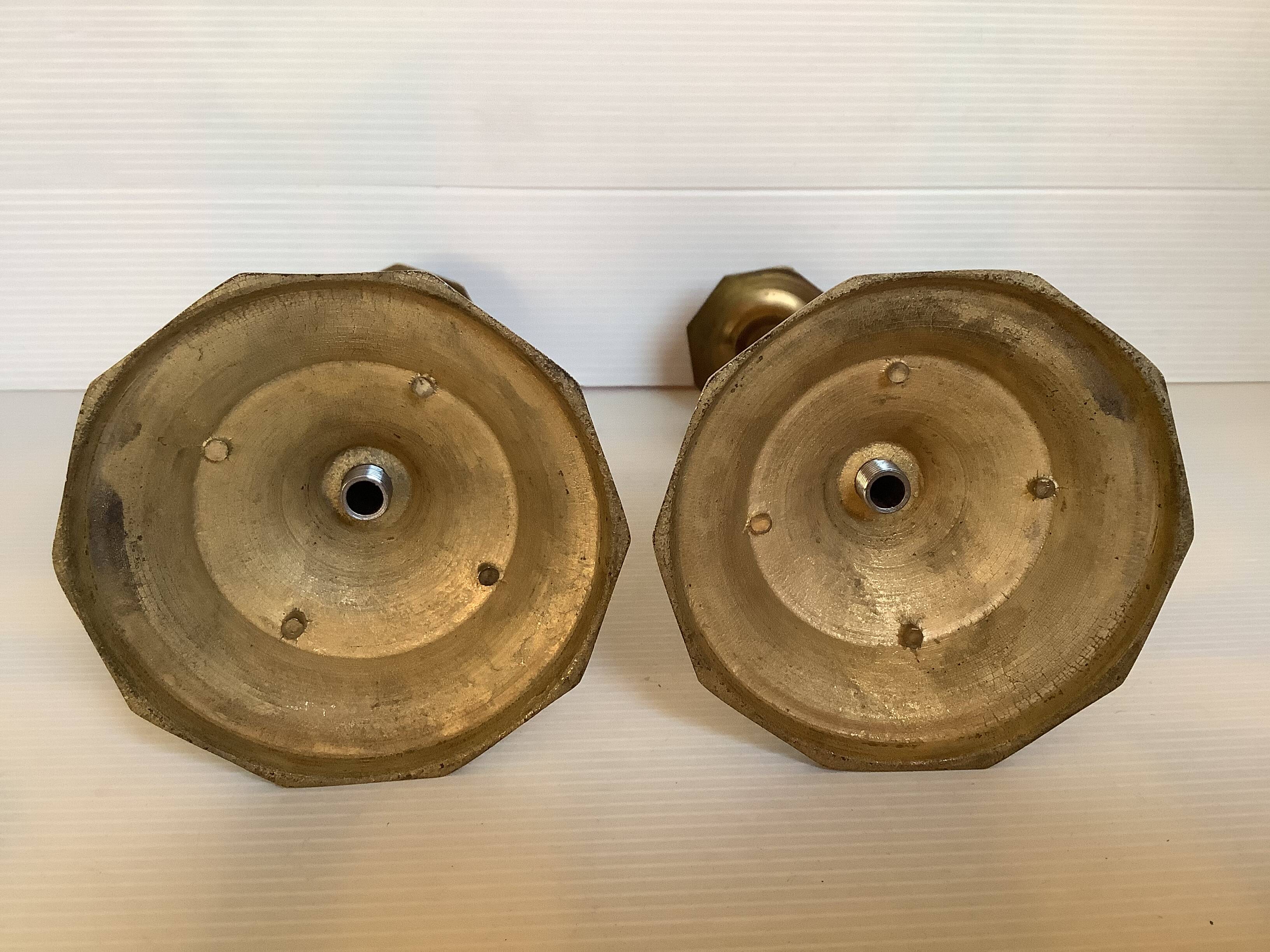 Four brass candle holders