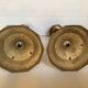 Four brass candle holders