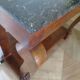 Empire/Restoration style console table with scrolled ends, mirrored back, and claw feet.