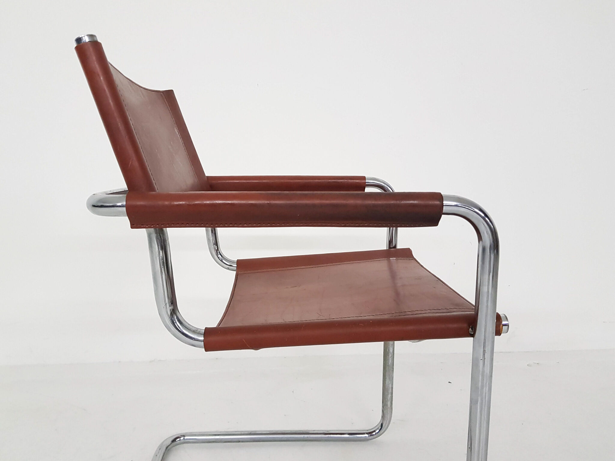 Tubular dining chair with arm rests, 1970's