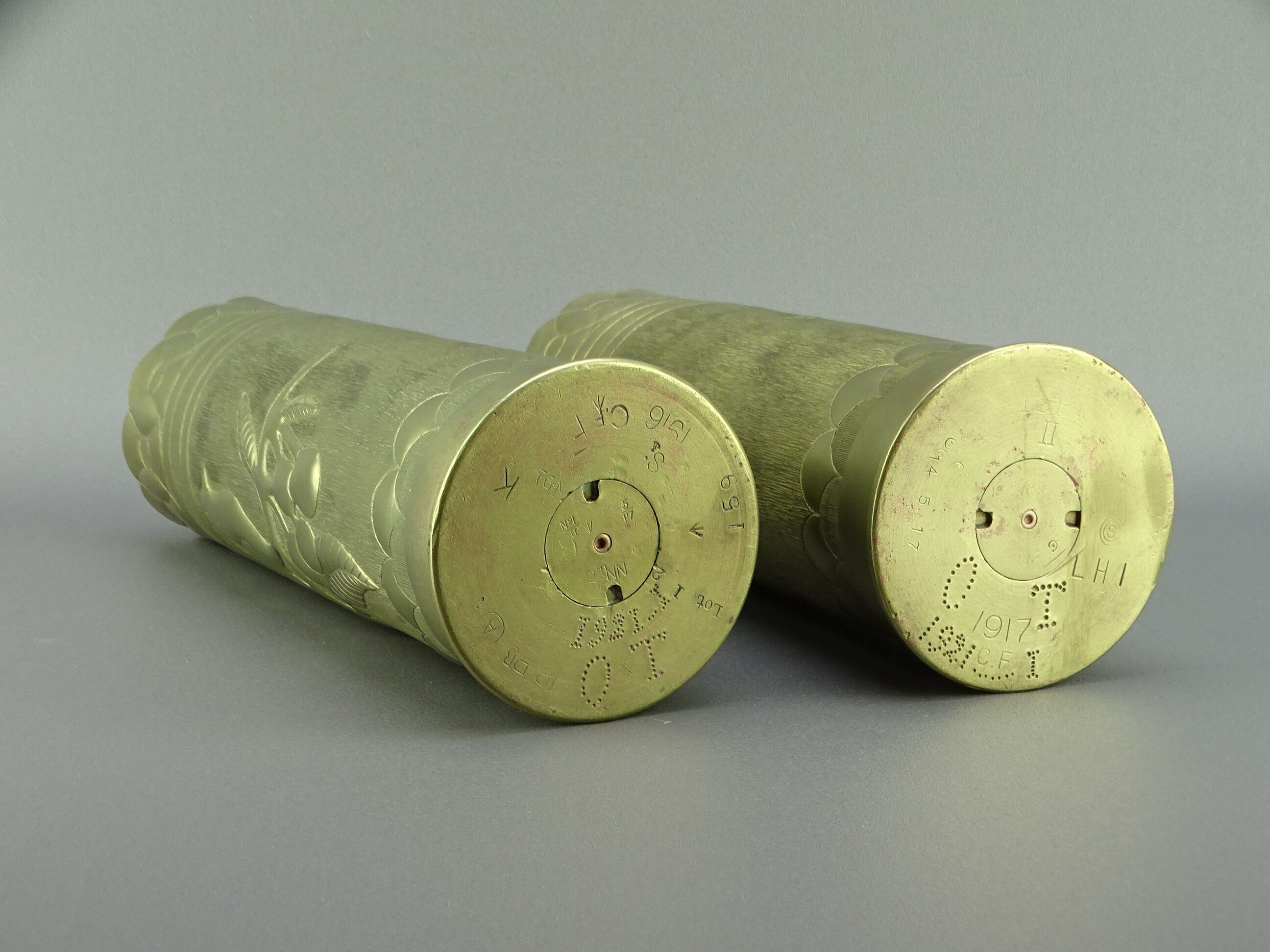 Pair of shell casings forming repulsed copper vases