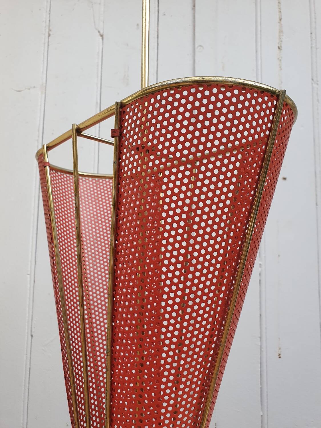 Perforated metal umbrella stand and scoubidou