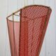 Perforated sheet metal umbrella stand and scoubidou
