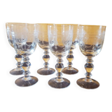 Six engraved crystal wine glasses. 1930