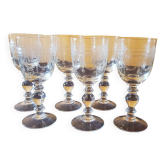 Six engraved crystal wine glasses. 1930