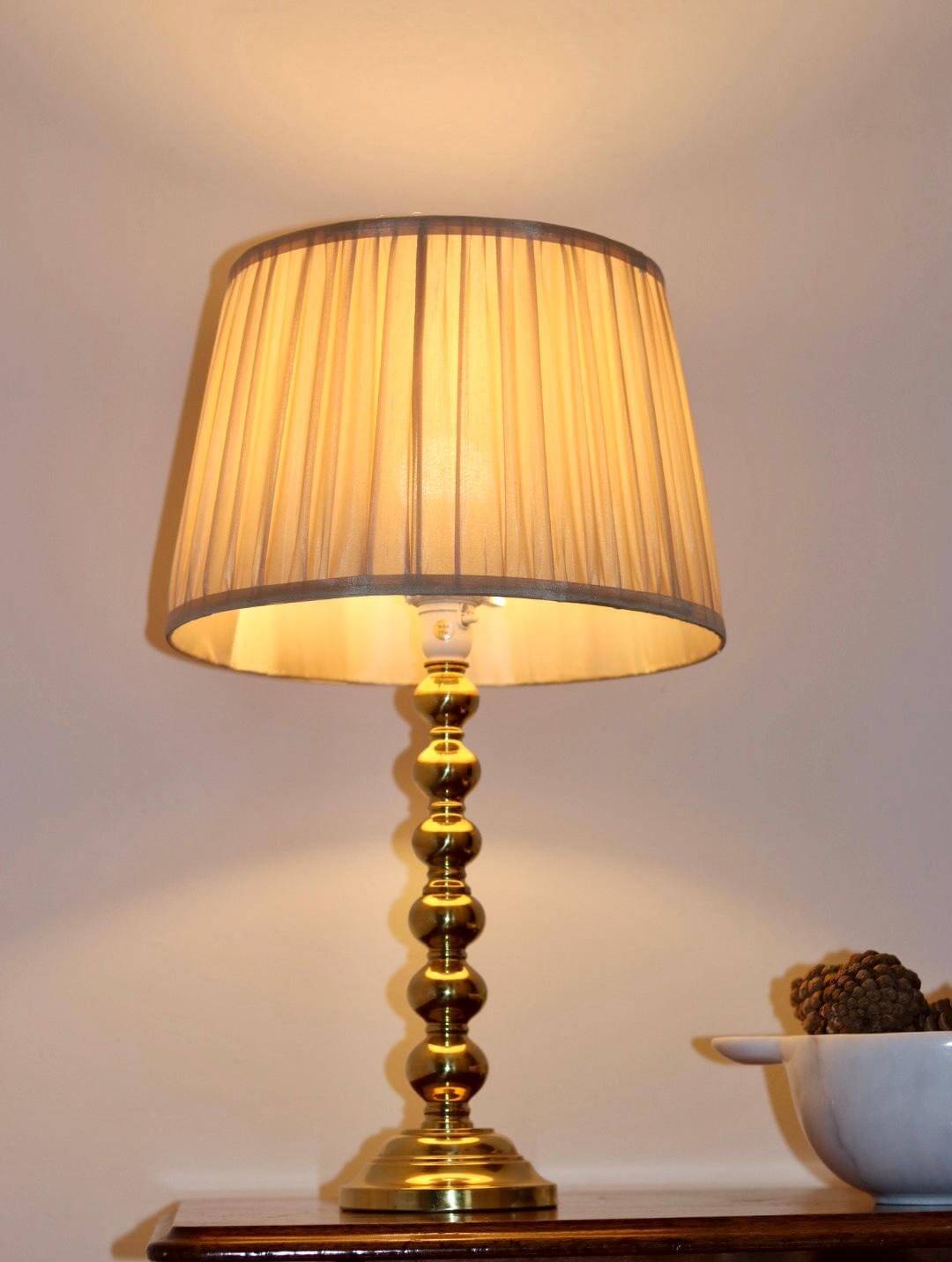 Pair of Swedish brass lamps from the mid-century.