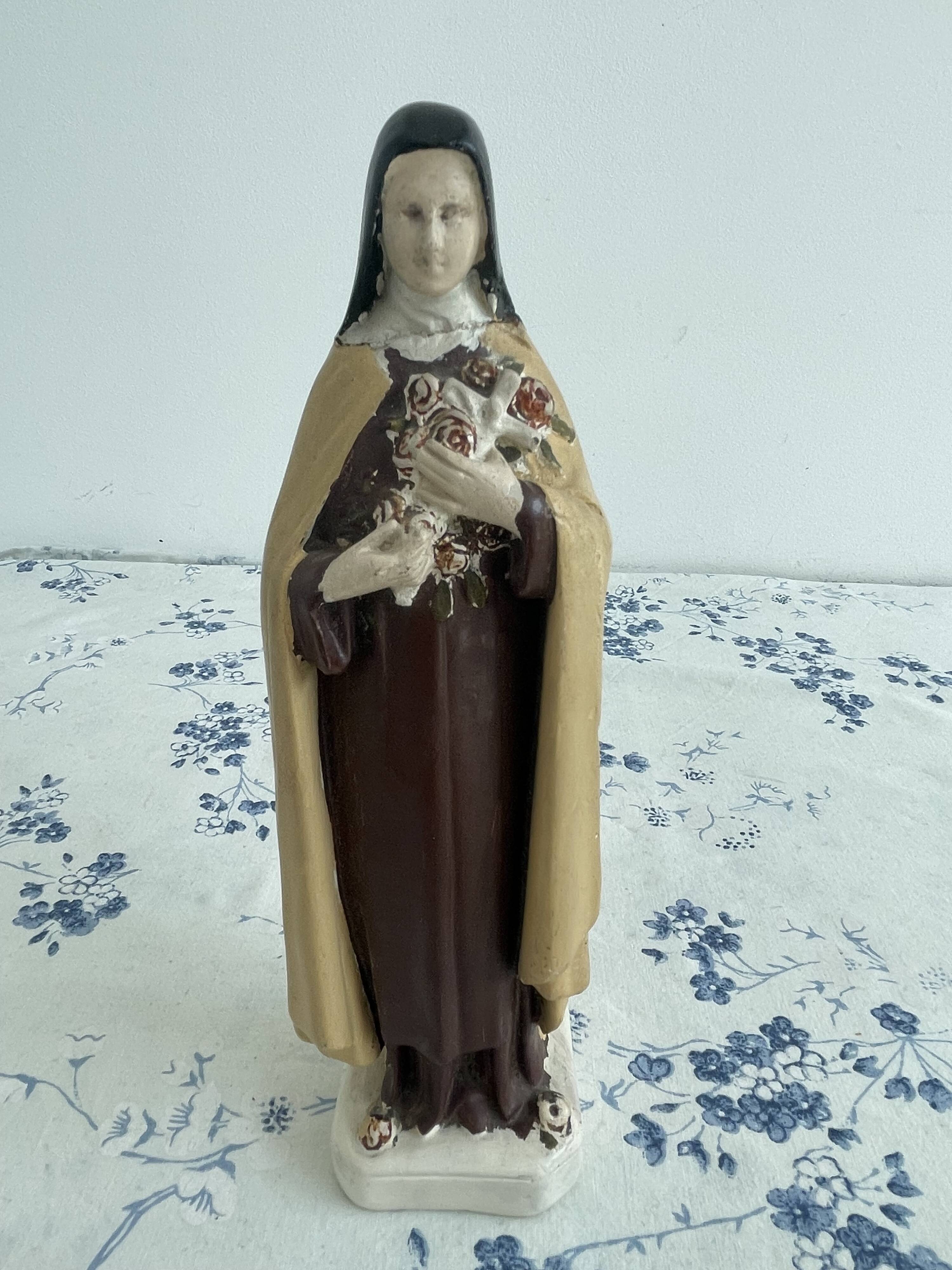 Antique statue of Saint Therese of Lisieux, religious plaster figurine