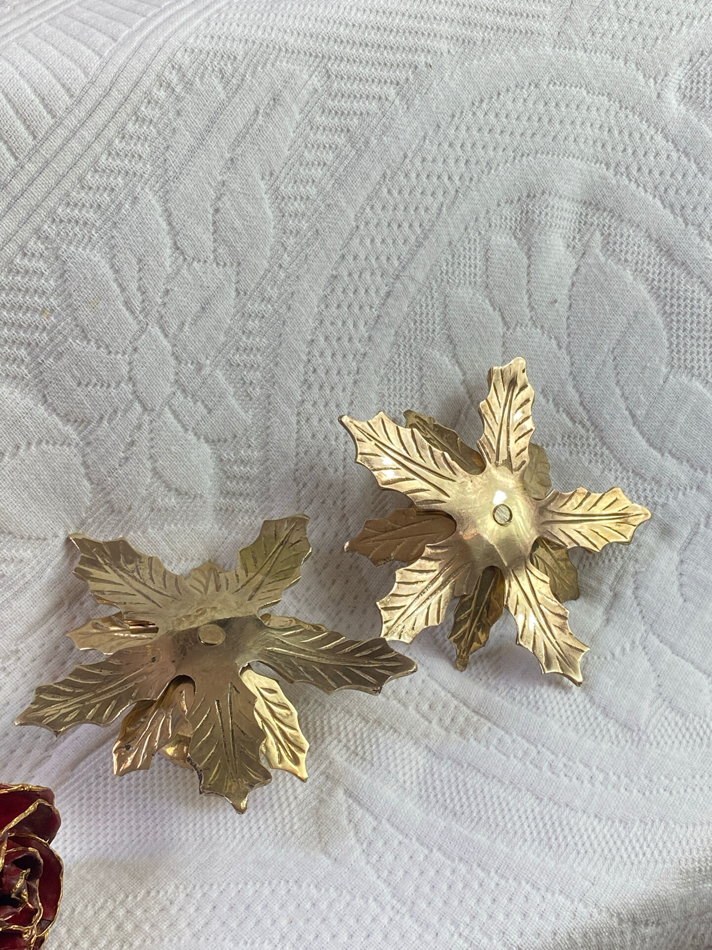 Pair of candlesticks, holly leaves, in brass