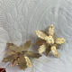 Pair of candlesticks, holly leaves, in brass
