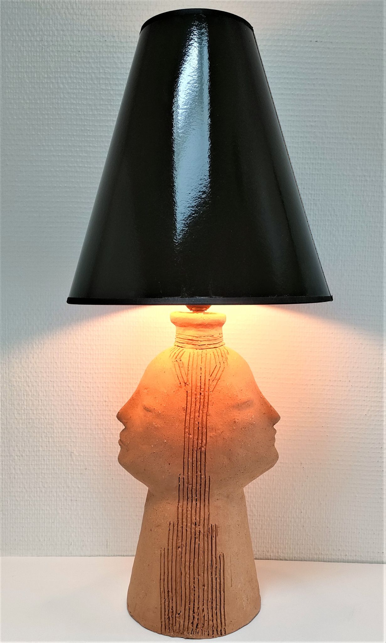 Anthropomorphic lamp foot depicting two faces terracotta design 80s
