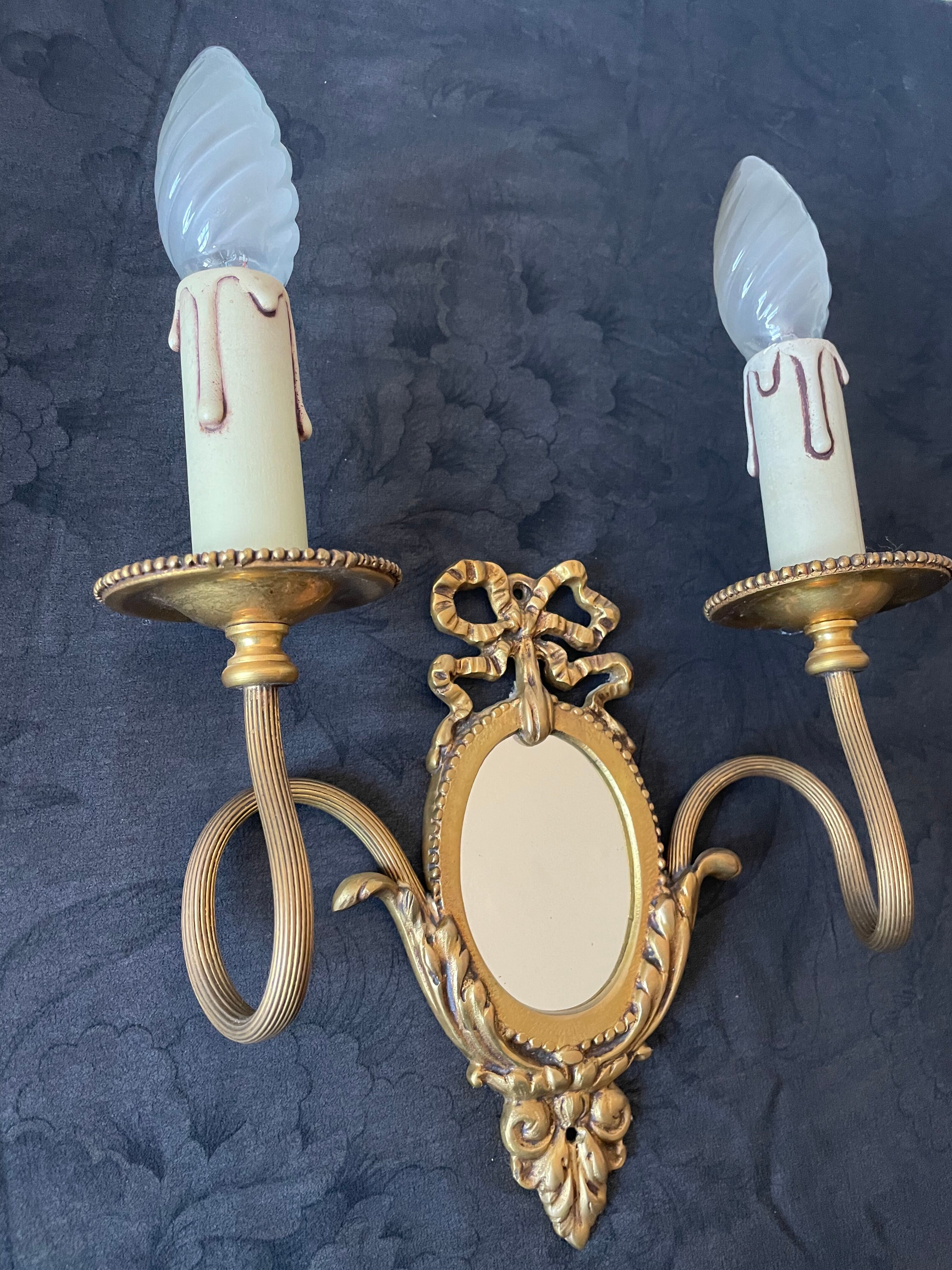 Pair of bronze wall lamps with mirror
